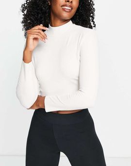 Nike Training Nike Yoga Luxe Dri-FIT cropped long sleeve top in off white