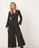 Nobody's Child Petite Nobody's Child Petite Valencia v-neck button front jumpsuit in black polka dots - 1