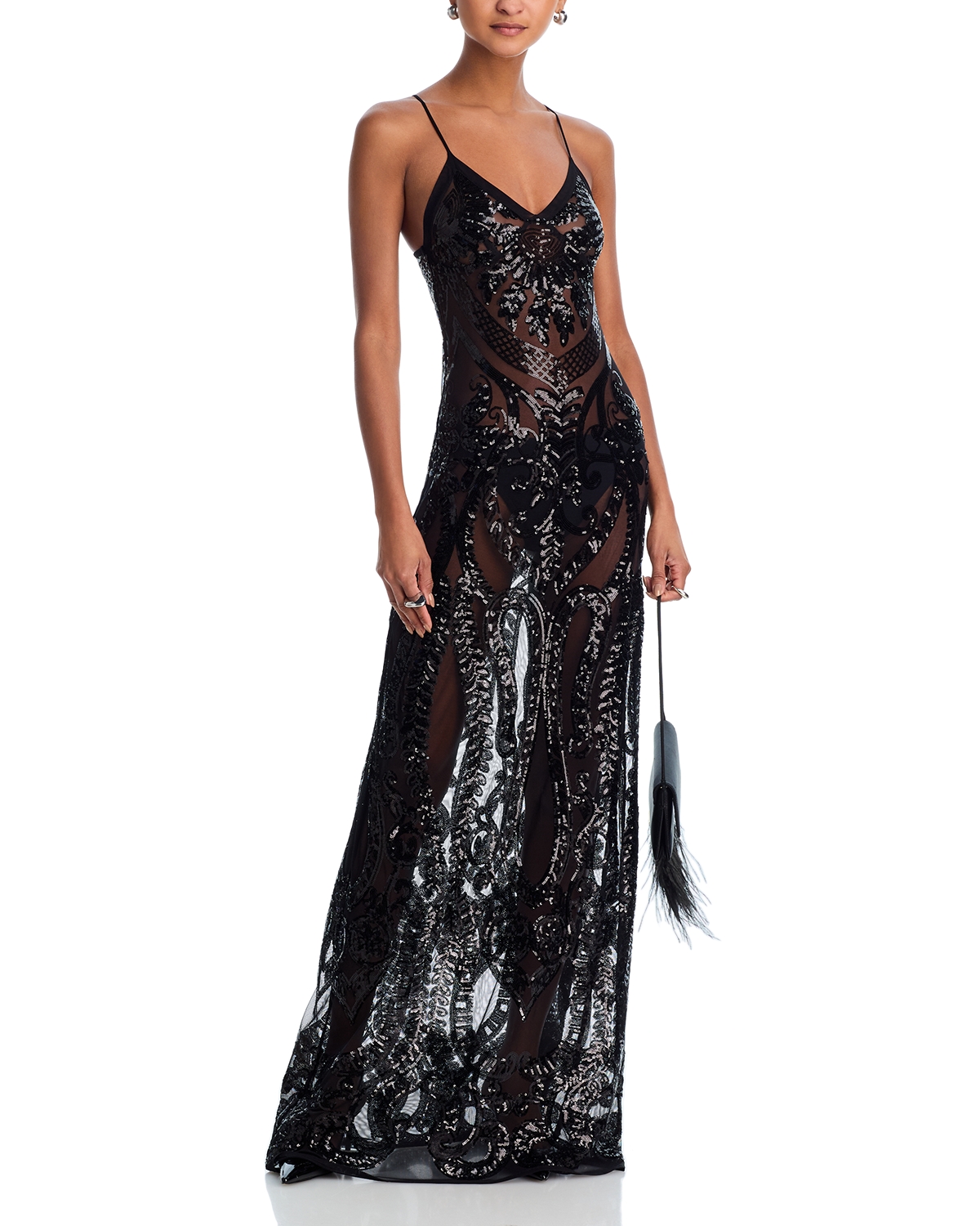 norma kamali sequin slip dress Draped in mystery and allure, the Norma Kamali sequin dress redefines evening elegance. Each sequin echoes whispers of sophistication, while the delicate V-neck beckons for admiration. A gown that invites you