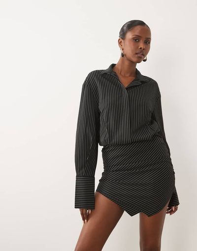 Noughts & Kisses Noughts & Kisses cotton rich button up asymmetric hem deep cuff mini shirt dress in black pinstripe