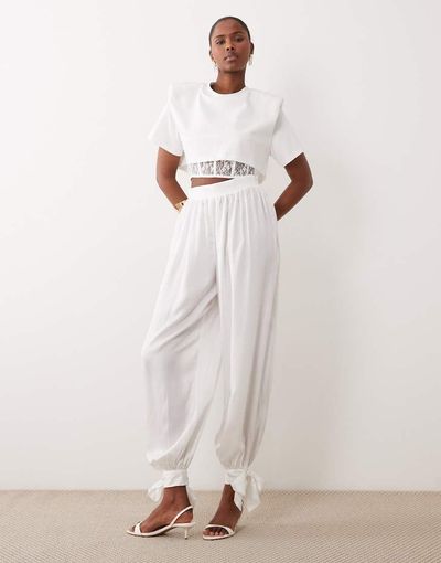 Noughts & Kisses Noughts & Kisses satin balloon leg tie detail pants in white - part of a set