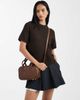 PASQ PASQ mini top handle and crossbody bag in brown - 1