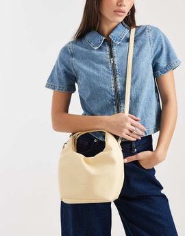 PASQ PASQ small top handle and crossbody drawstring bag in butter yellow