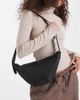 PASQ PASQ textured croissant crossbody bag in black - 1