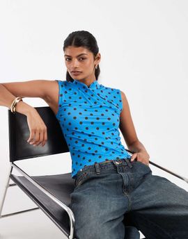 Pieces PIECES asymmetric button jersey top in blue and burgundy polka dot print