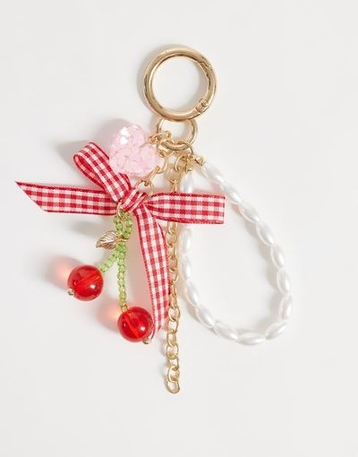 Pieces Pieces cherry bag charm in red and white