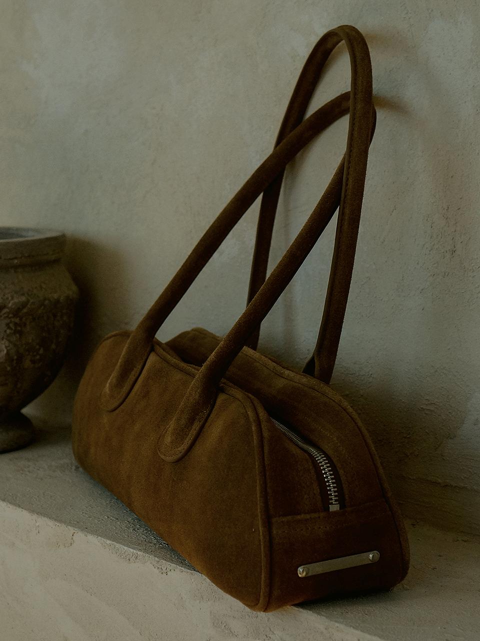 Prends soin de toi Suede bowling bag Brown