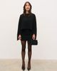 Pretty Lavish Pretty Lavish 2 in 1 knitted mini dress with cape in black - 1