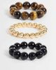 Reclaimed Vintage Reclaimed Vintage chunky three pack of bracelets in tigers eye, black and gold-Brown - 1