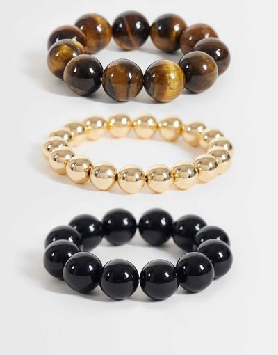 Reclaimed Vintage Reclaimed Vintage chunky three pack of bracelets in tigers eye, black and gold-Brown
