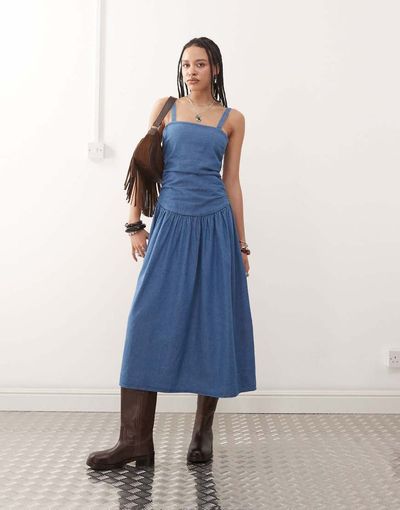 Reclaimed Vintage Reclaimed Vintage dropped waist gathered detail midi denim dress in authentic midwash blue
