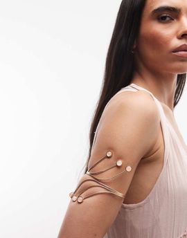 Reclaimed Vintage Reclaimed Vintage festival arm cuff with gem stone detail in gold