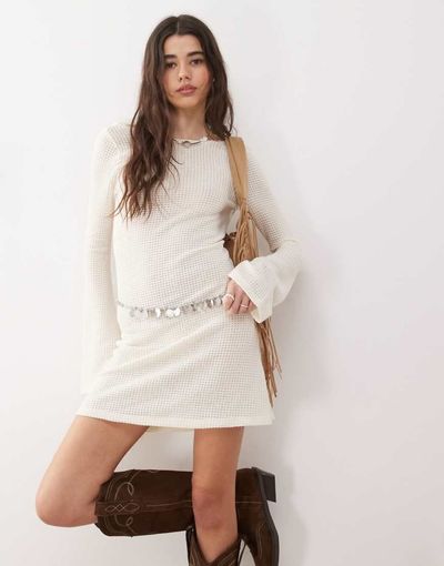Reclaimed Vintage Reclaimed Vintage flared sleeve crochet beach mini dress in cream-White