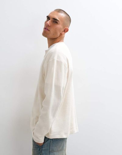 Reclaimed Vintage Reclaimed Vintage long sleeve waffle knit henley neck t-shirt in cream-White