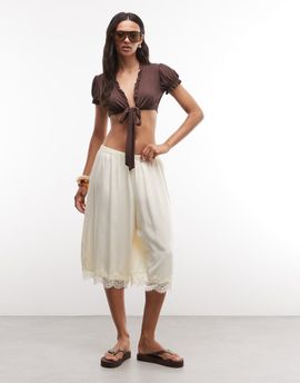 Reclaimed Vintage Reclaimed Vintage longline satin shorts with lace trim in ecru-White
