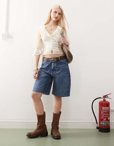 Reclaimed Vintage Reclaimed Vintage low rise baggy denim jorts in mid blue wash