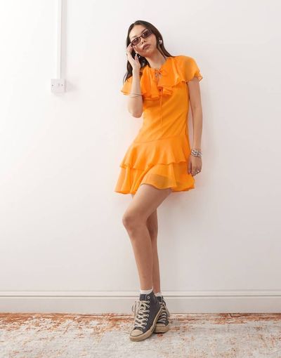 Reclaimed Vintage Reclaimed Vintage mini dress with cape detail and tiers in orange-Multi