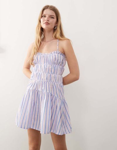 Reclaimed Vintage Reclaimed Vintage mini sun dress with ruching and cross back detail in purple stripe-Multi