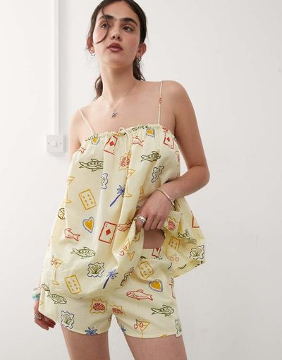 Reclaimed Vintage Reclaimed Vintage pull on relaxed beach shorts in yellow postcard print-Multi