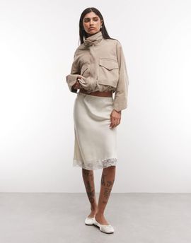 Reclaimed Vintage Reclaimed Vintage satin awkward length skirt with lace trim in ivory-White