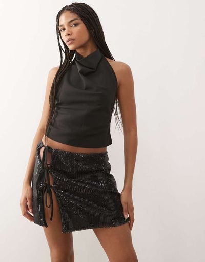 Reclaimed Vintage Reclaimed Vintage sequin mini skirt with side ties in black-Multi
