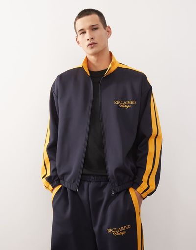 Reclaimed Vintage Reclaimed Vintage track jacket in navy with side stripes - part of a set