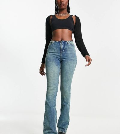 Reclaimed Vintage Reclaimed Vintage waistbandless skinny stretch flare in mid wash blue