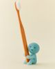 Smiski® Smiski Glow-In-The-Dark Toothbrush Stand in Green at Urban Outfitters - 1
