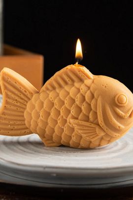 Southlake Gifts Southlake Gifts Taiyaki Candle in Golden Brown at Urban Outfitters