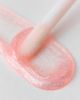 The Crème Shop The Crème Shop X Sanrio Hello Kitty Tinted Jelly Lip Oil Ornament in Pink Shimmer at Urban Outfitters - 5