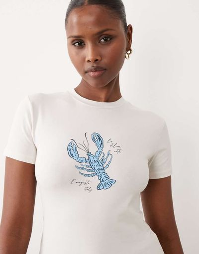 The Frolic The Frolic cotton rich exclusive lobster front graphic baby tee in white