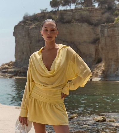The Frolic The Frolic exclusive chiffon ruffle skirt drape front beach mini dress in lemon-Yellow