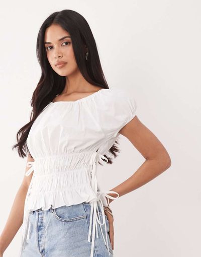 The Frolic The Frolic exclusive cotton shirred tie side detail top in white