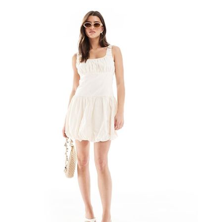 The Frolic The Frolic exclusive poplin ruched bust dropped waist puffball mini dress in cream-White