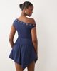 The Frolic The Frolic exclusive slinky eyelet detail asymmetric pleated skirt mini dress in navy - 4