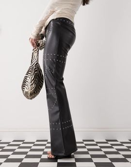 The Kript The Kript low rise leather pants with studs in black