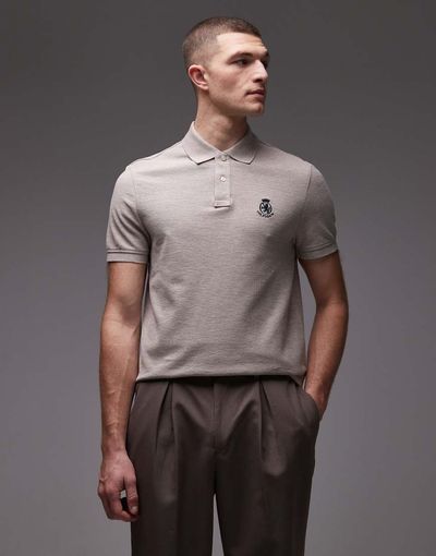 Tommy Hilfiger Tommy Hilfiger crest logo polo shirt in beige-Neutral