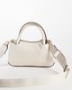 Tommy Hilfiger Tommy Hilfiger logo tape strap mini bag in soft cream-White - 2
