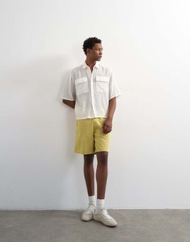 Topman Topman relaxed fit bermuda sweat shorts in washed yellow
