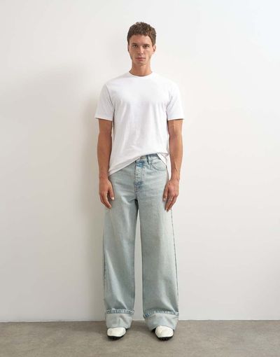 Topman Topman rigid baggy fit jeans with turn-up hem in light wash-Blue