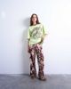 Topshop Topshop abstract animal print plisse pants in brown - 1