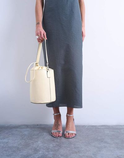 Topshop Topshop Carla large crossbody bucket bag in buttermilk-Yellow