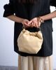 Topshop Topshop Gabriette metal trim handle purse in buttermilk-Yellow - 3
