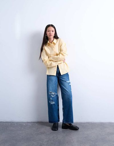 Topshop Topshop mid rise cinch jeans with knee rips in mid blue