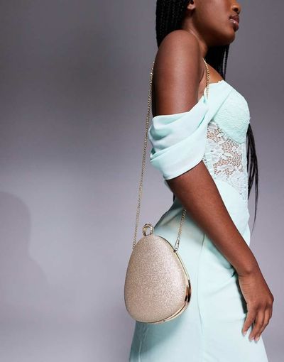 True Decadence True Decadence hard clutch bag with crossbody strap in gold glitter-pink