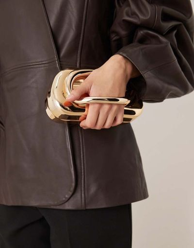 True Decadence True Decadence hard clutch purse with handle detail in gold