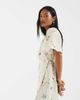 Vero Moda Petite Vero Moda Petite flutter sleeve wrap front mini dress in cream floral print-White - 1