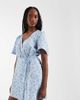 Vero Moda Tall Vero Moda Tall flutter sleeve wrap front mini dress in blue floral print - 1