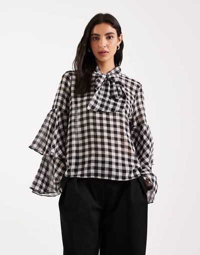 Vero Moda Vero Moda tie neck gingham blouse with tiered cuffs in black and white