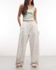 Weekday Weekday barrel parachute pants in off-white - 1
